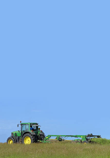 John Deere 6920 Tractor and Mower cutting Grass for Silage on a Farm in UK