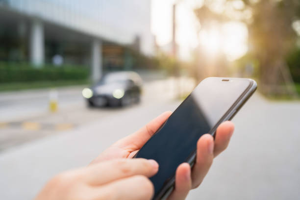 istock Hand using smartphone in public areas, During leisure time. The concept of using the phone is essential in everyday life. 1468364001