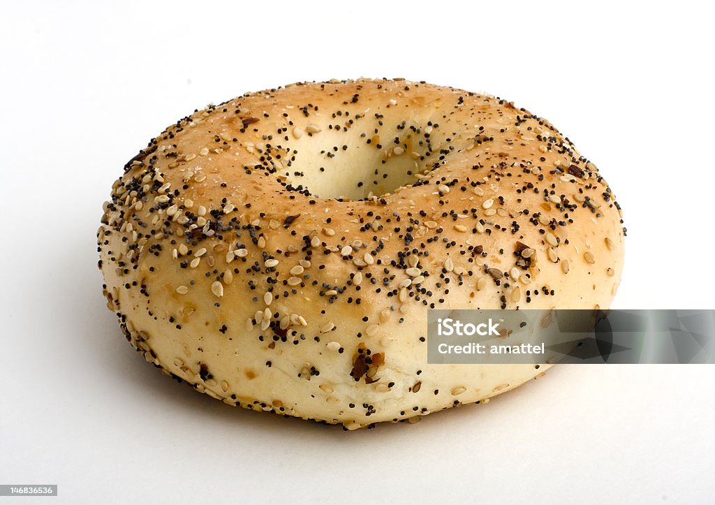 Everything Bagel An everything bagel with various seeds and onions on it Bagel Stock Photo