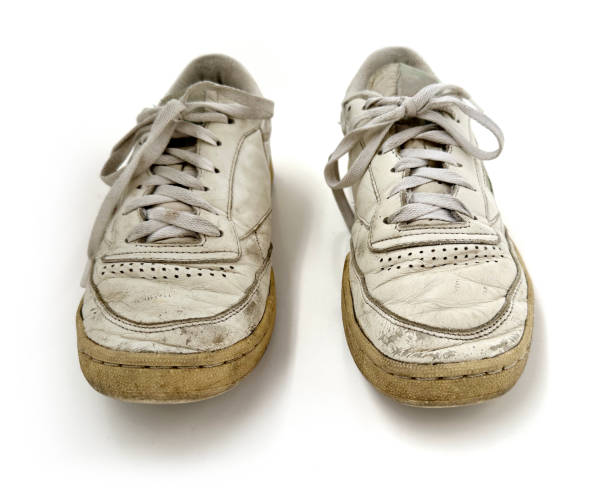 Old Vintage Generic Leather Sneakers Clear-Cut on White Background Various angles of a pair of  old vintage generic leather sneakers in heavily worn out condition. Clear-cut on a white seamless background grotesque stock pictures, royalty-free photos & images