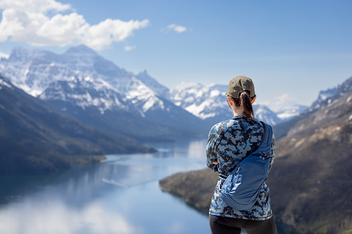 Woman Looking At The View While Hiking at Bear's Hump Trail in Waterton Lakes National Park, Alberta, Canada