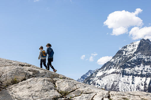 Mother and Son Hiking at Bear's Hump Trail in Waterton Lakes National Park, Alberta, Canada