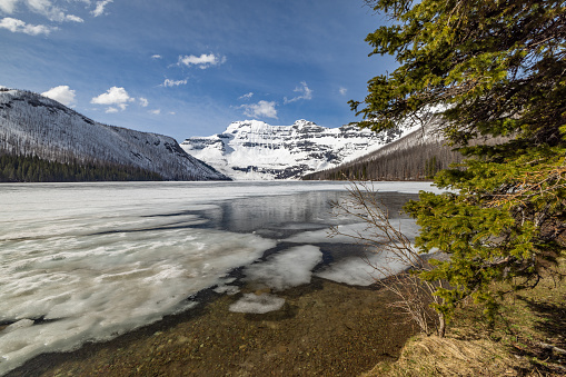 Cameron Lake in Waterton Lakes National Park, Alberta, Canada.\n\nThe lake is still frozen at the end of May.