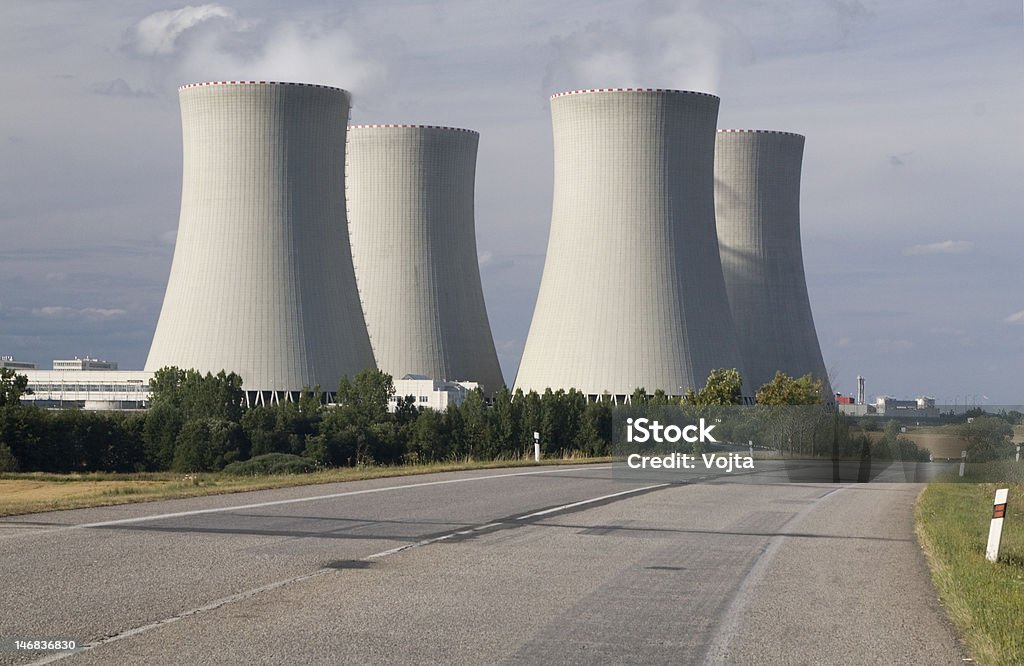 Nuclear power station Nuclear power station, Temelin, Czech Republic - cooling towers, containment buildings, stubble-field in foreground Cable Stock Photo