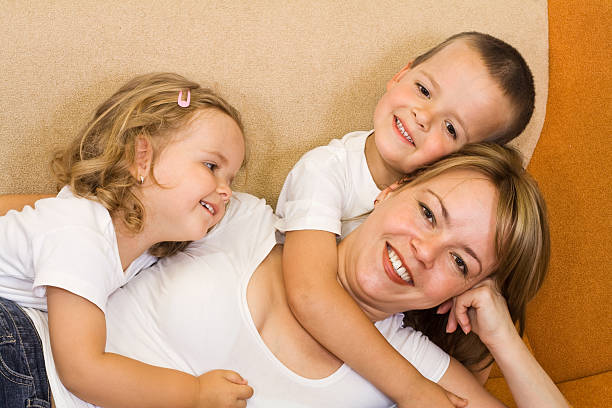 istock Woman and kids on the sofa 146836975