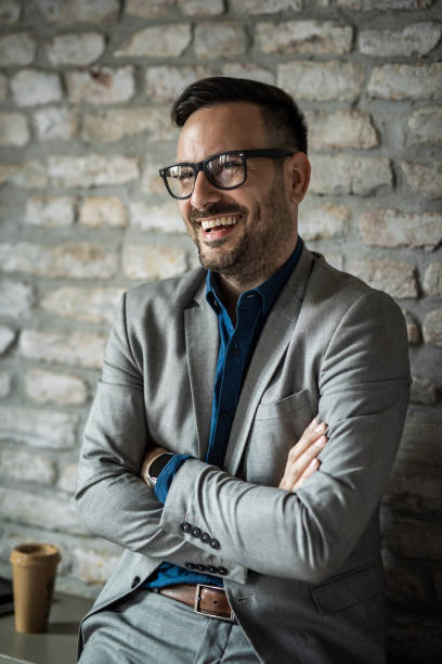 istock Cheerful businessman relaxing in office. 1468371019