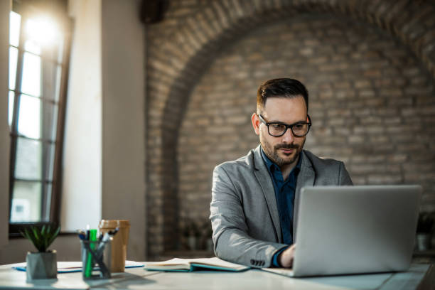 istock Businessman doing creative work on his laptop in the office. 1468371172