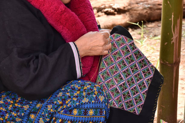 istock Close-up hand female Mien hilltribe embroider pattern colored thread 1468371468