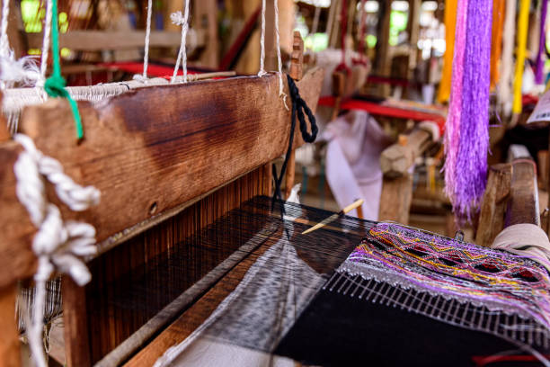 istock Traditional woven fabric Mae Chaem pattern that has not finished weaving in the loom at Mae Chaem District, Chiang Mai Province, Thailand 1468371828