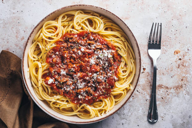 istock Flat lay view of spaghetti with bolognese sauce on stone background. 1468376257