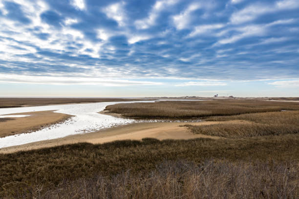 istock A view of marsh, river and dramatic clouds near Racepoint Lighthouse 1468376465