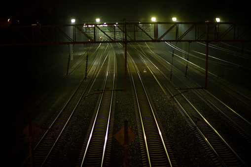 Railroad at night. Rails at station. Many tracks for trains. in Moscow, Moscow, Russia