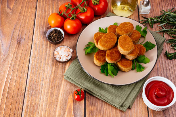 chicken nuggets on a plate with sauce, wooden countertop in Washington, District of Columbia, United States
