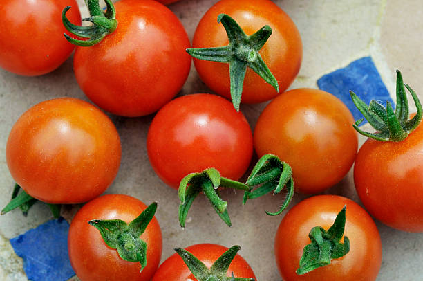 Tomatoes on a mosaic table stock photo