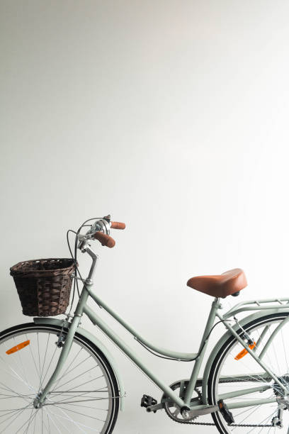 istock Vintage bicycle green with basket on white background 1468378381
