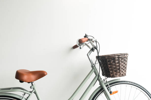 istock vintage green bicycle with brown basket on white background 1468378384