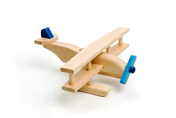 istock Miniature wood airplane isolated on white 146838251