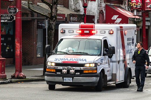 Vancouver, British Columbia Canada - February 18 2023: Ambulance attending an incident in Chinatown, East Vancouver.