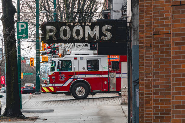 Fire Engine In East Vancouver Vancouver, British Columbia Canada - February 18, 2023: A firetruck parked in the East Vancouver district waiting to be called upon. east vancouver stock pictures, royalty-free photos & images