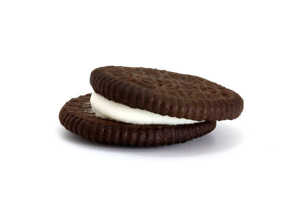 istock cookies chocolate with cream filling between isolated on white background 1468403658