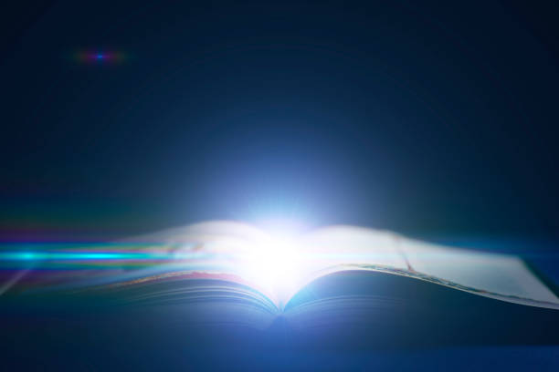 istock opened book with a light strike out of it, concept of knowledge and studying 1468405382