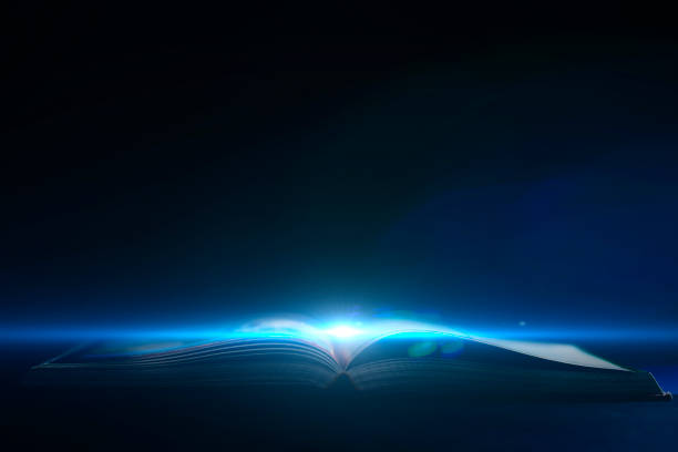 opened book with a light strike out of it, concept of knowledge and studying