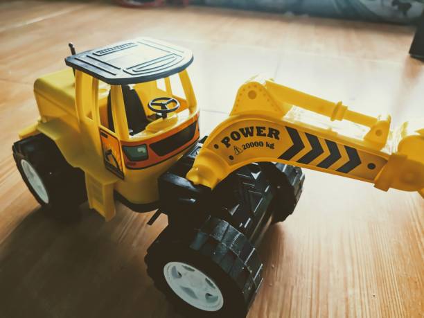 Yellow Excavator Toys was shot from wide top angle