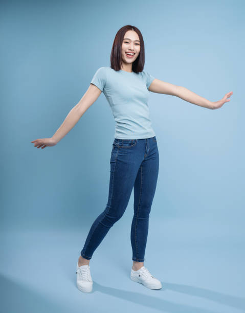 istock Image of young Asian woman posing on background 1468406780