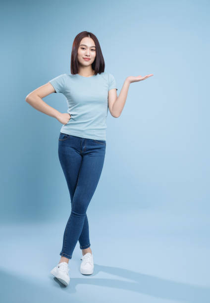 istock Image of young Asian woman posing on background 1468406790