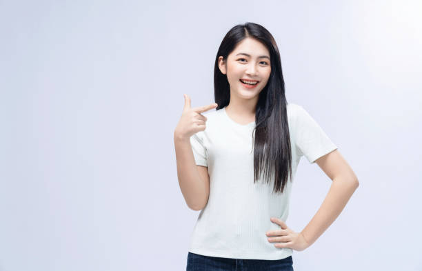istock Young Asian girl posing on background 1468408257