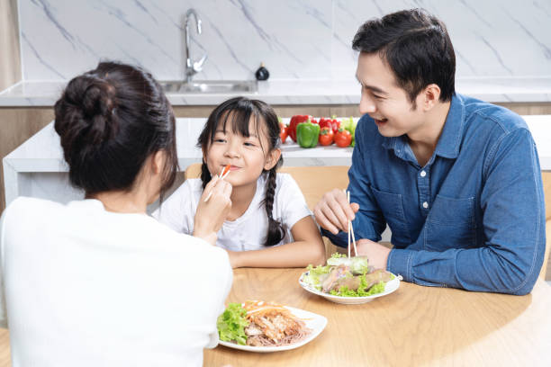 istock Image of Asian family in the kitchen 1468410021