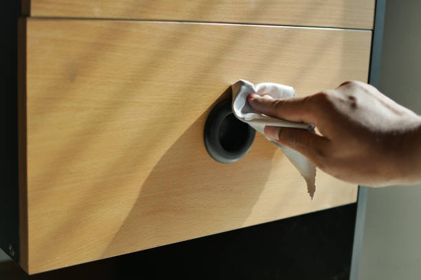 istock person hand cleaning drawer with a tissue 1468420378