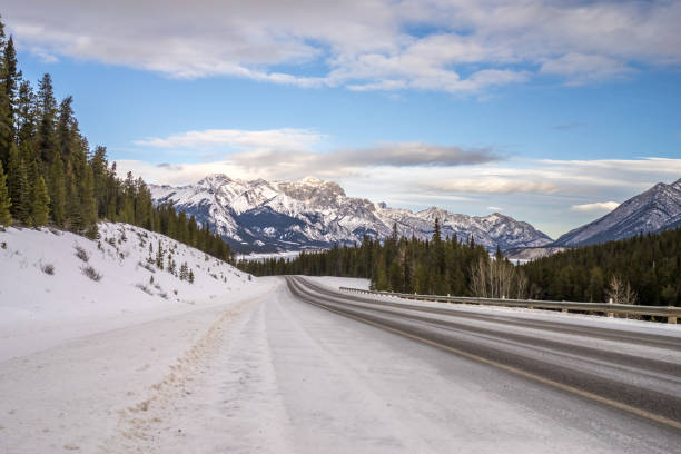 Highway along Abraham lake landscape in winter season with snow stock photo