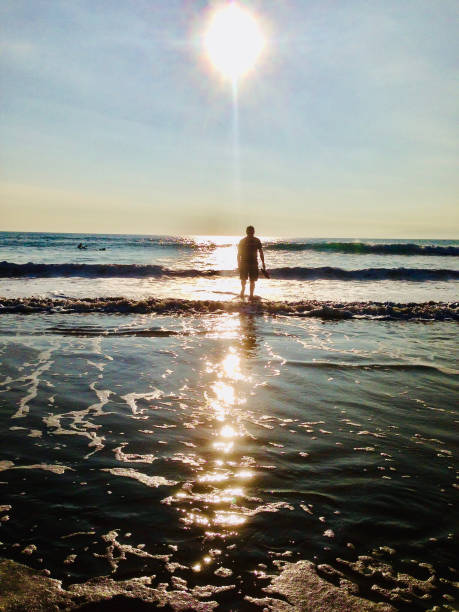 Taking a sunset paddle in the sea off the coast of Pembrokeshire UK