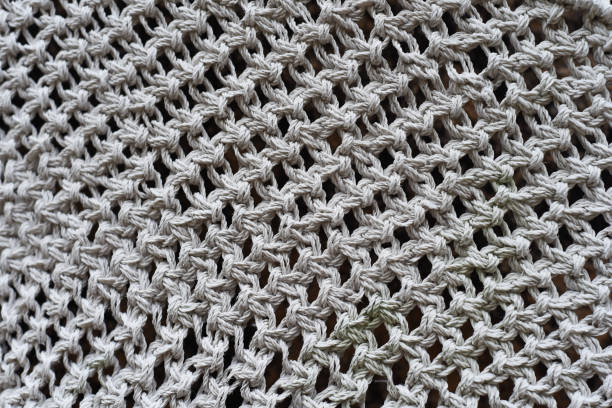 istock Various knots of macrame technique made of white threads 1468423520