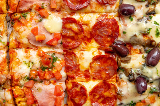 istock Full frame of various types of pizza rectangle-shaped 1468428809