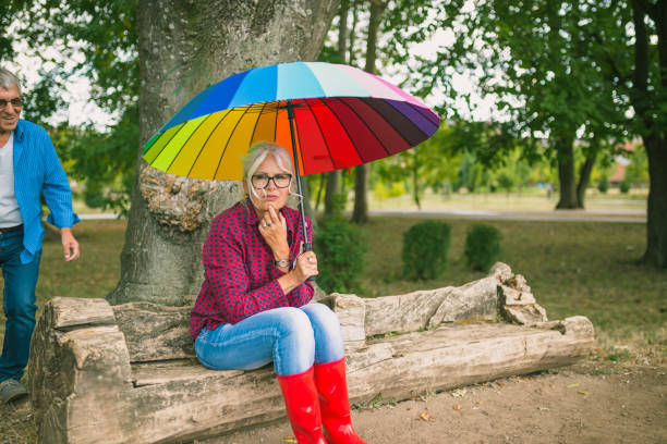 istock Couple walking in wet day 1468429810