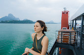 Woman traveling with ferry in Thailand
