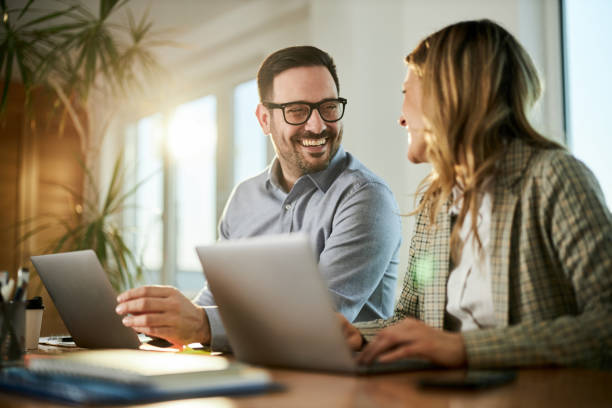 istock Happy business couple talking while working at home office. 1468435148