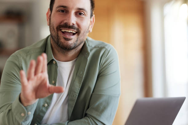 istock Happy man talking during a video call from home. 1468435450
