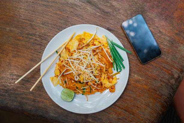 istock Smartphone near the plate of Pad Thai 1468435471