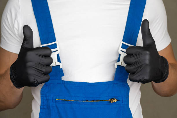 Showing thumbs up. Wizard is isolated on gray background with space for copying. Man in blue jumpsuit without face shows class sign, with copyspace for text on white T-shirt. Showing thumbs up. Wizard is isolated on gray background with space for copying. Man in blue jumpsuit without face shows class sign, with copy space for text on white T-shirt. construction safety slogans stock pictures, royalty-free photos & images