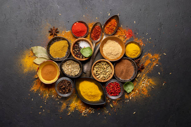 istock Various spices in bowls and spoons on stone table 1468438138