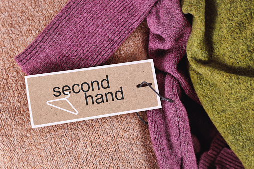 Second hand clothing concept with textiles with label