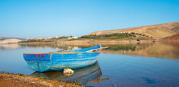 Meknes province,  boat on the lake and relfection of mountain
