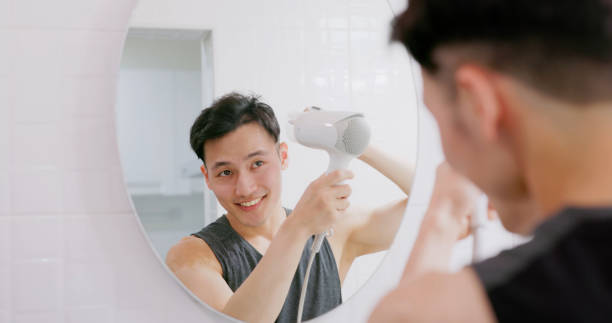 istock asian man use hair dryer 1468441793
