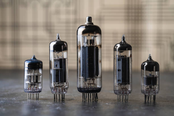 istock Old diode lamps of different sizes on a table, closeup. Several different vacuum tubes for old radio and TV 1468443258