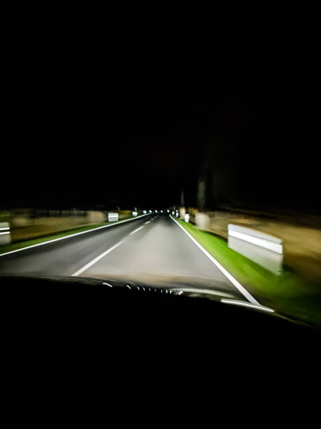 istock View from a moving car on a country road at night 1468444076