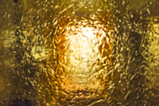 A ray of sunlight seen through a translucent window glass
