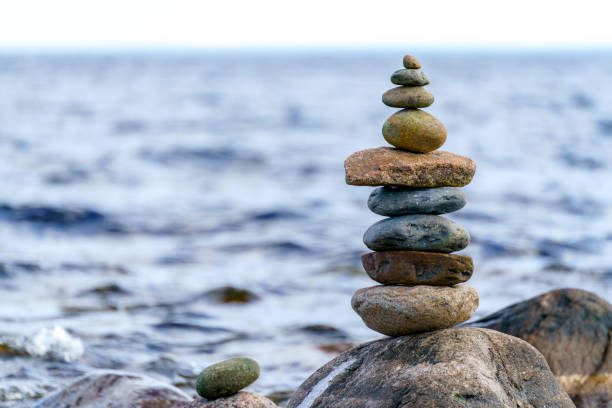 istock Pyramid of stones. Unstable balance of stone objects. 1468451118